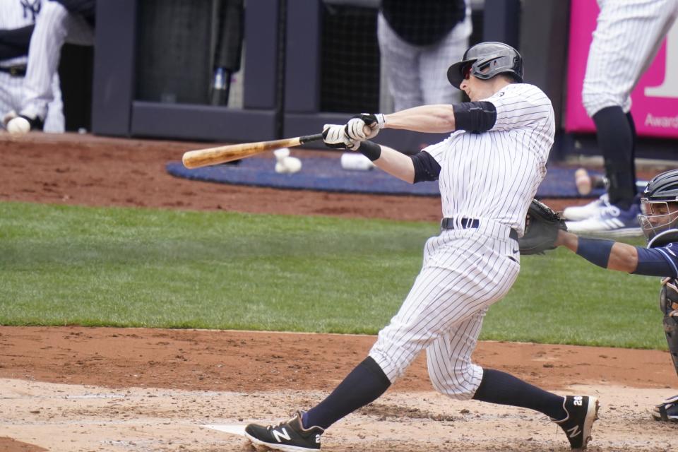 New York Yankees' DJ LeMahieu hits an RBI single during the second inning of a baseball game against the Tampa Bay Rays, Saturday, April 17, 2021, in New York.(AP Photo/Frank Franklin II)