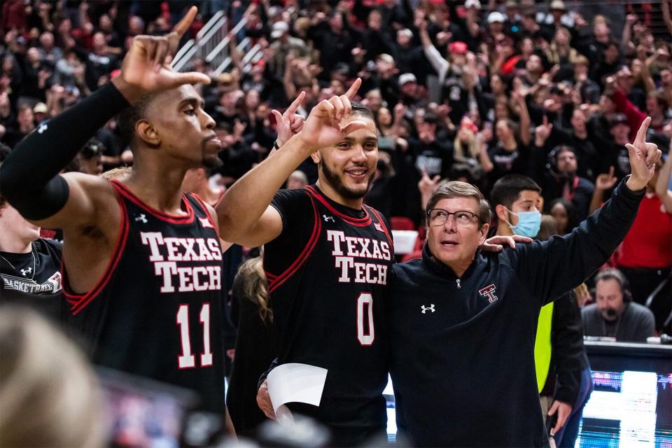 LUBBOCK, TEXAS - FEBRUARY 01: Forwards Bryson Williams #11 and Kevin Obanor #0 and head coach Mark Adams of the Texas Tech Red Raiders react after the college basketball game against the Texas Longhorns at United Supermarkets Arena on February 01, 2022 in Lubbock, Texas. (Photo by John E. Moore III/Getty Images)