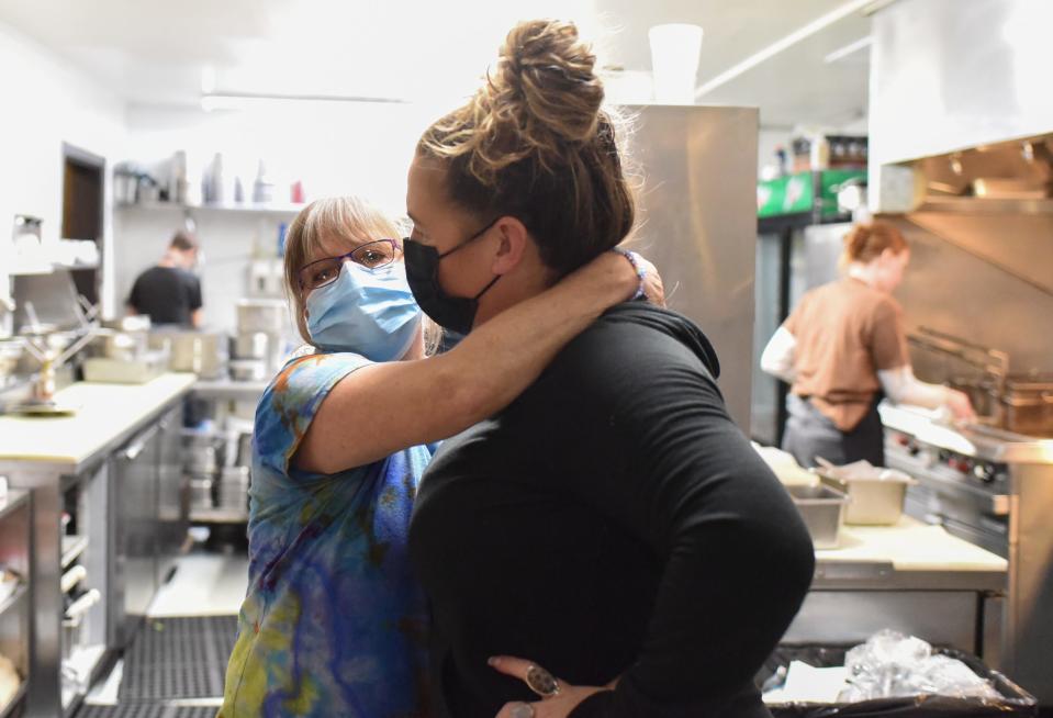 "I love this woman," Tammie Bunker, left, of Weston's Kewpee Sandwich Shoppe says hugging owner Autumn Weston, Wednesday, Nov. 30, 2022. Bunker has worked at the restaurant for four decades. The Westons consider her family.