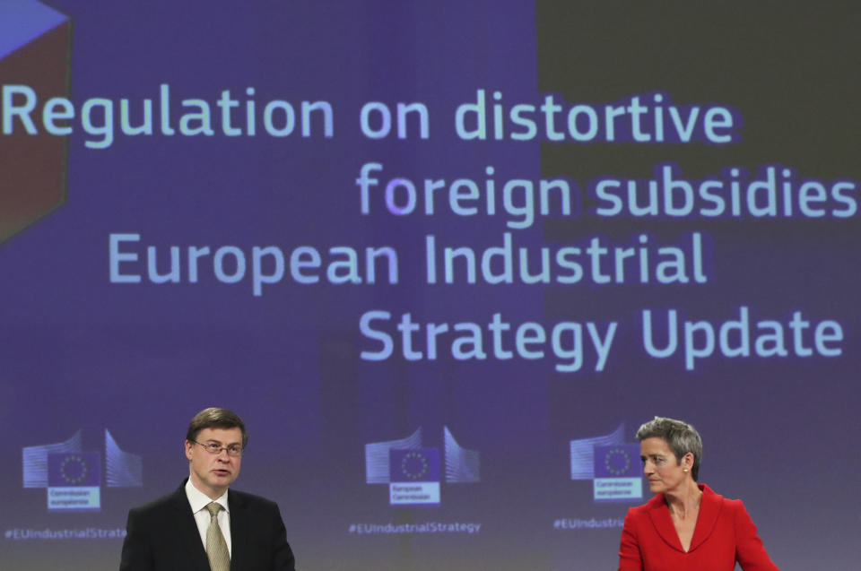 European Commission Vice Presidents Margrethe Vestager, right, and Valdis Dombrovskis participate in a media conference on the proposal for a Regulation to address distortions caused by foreign subsidies in the Single Market and on the European Industrial Strategy Update at EU headquarters in Brussels, Wednesday, May 5, 2021. (Yves Herman, Pool via AP)