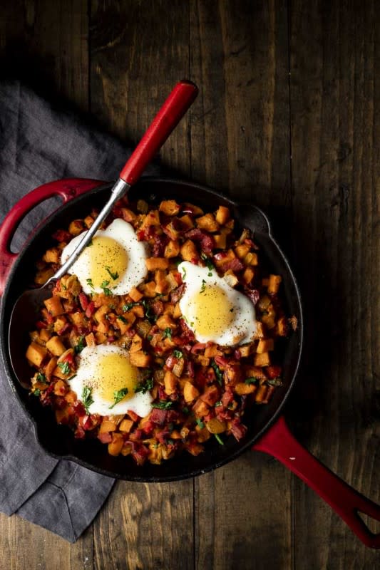 <p>Went Here 8 This</p><p>The ultimate breakfast comfort food that gives you smoky and spicy flavors, veggies and baked eggs in 30 minutes.</p><p><strong>Get the recipe: <a href="https://www.wenthere8this.com/sweet-potato-hash/" rel="nofollow noopener" target="_blank" data-ylk="slk:Sweet Potato Hash with Ham and Eggs;elm:context_link;itc:0;sec:content-canvas" class="link ">Sweet Potato Hash with Ham and Eggs</a></strong></p>