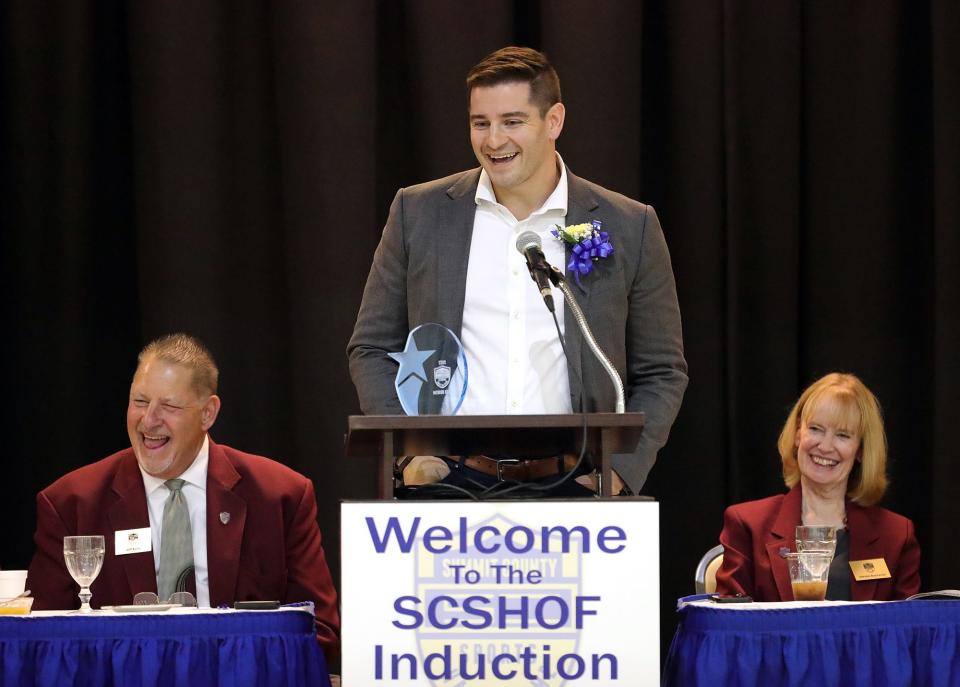 Hudson graduate Alex Gedeon speaks during the Summit County Sports Hall of Fame Induction ceremony, Tuesday, Oct. 4, 2022, in Akron, Ohio.