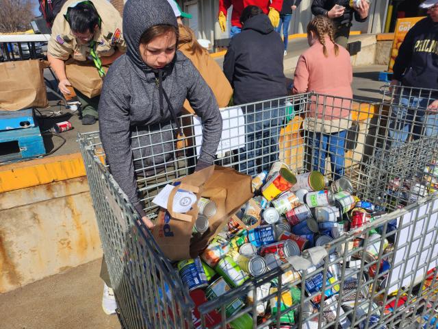 More than 50 area Boy Scout troops work to deliver food donations to the High Plains Food Bank Distribution Center on Saturday morning. This year's goal for the 2023 Scouting for Food drive is collecting 100,000 meals.