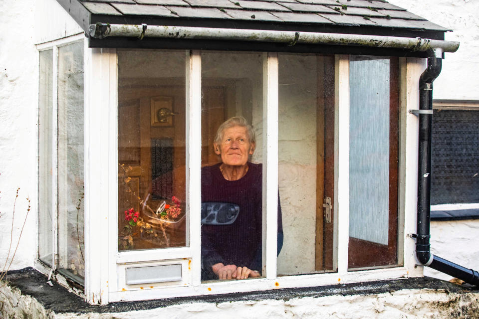 Alan Gosling at his home in Buckfastleigh, Devon. 7th January 2022  See SWNS story SWTPbird. The family of a retiree named as the UK's bird flu 'patient zero' say they are worried about him - as he is locked inside all alone. Alan Gosling, 79, was identified yesterday (January 6) as the first person across the nation to become infected with a particular strain of avian flu. The dad-of-three, from Buckfastleigh, Devon, was tested after some of his ducks fell ill in late December - which resulted in all 160 of his flock being culled soon after. Health authorities ran tests to see if Alan had become infected despite the fact the H5N1 strain had never infected a human before - and he came back positive.  