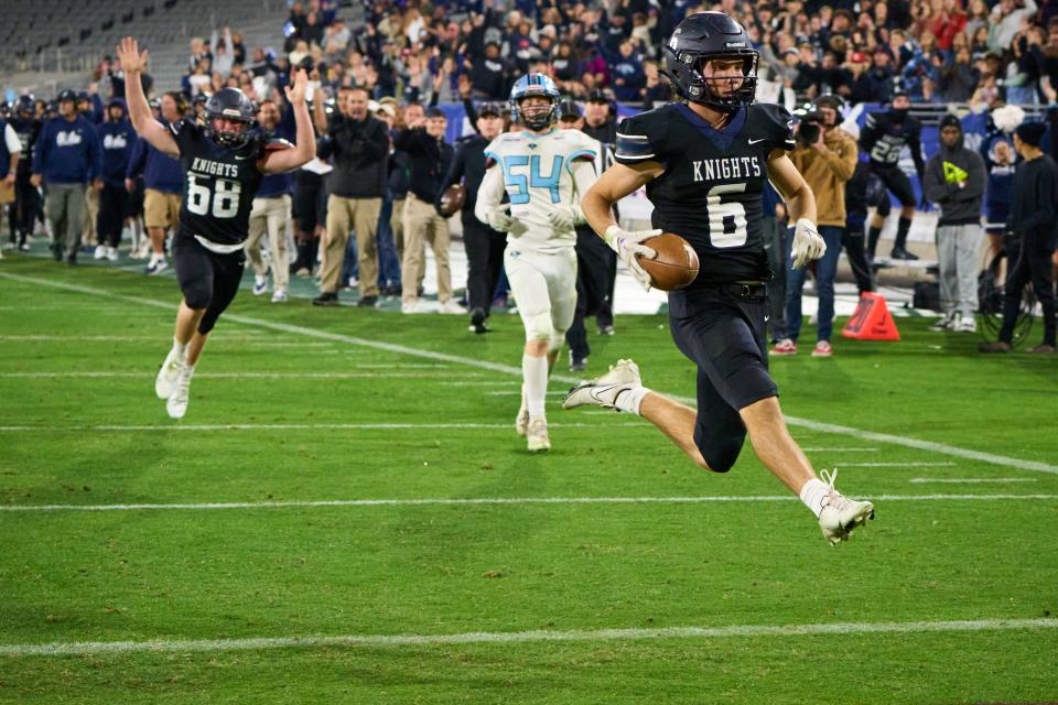 Dec 9, 2022; Tempe, AZ, USA; Higley Knights wide receiver Carter Hancock (6) dashes into the end zone against the Cactus Cobras during the AIA 5A state championship game at Sun Devil Stadium in Tempe on Friday, Dec. 9, 2022. Mandatory Credit: Alex Gould/The Republic