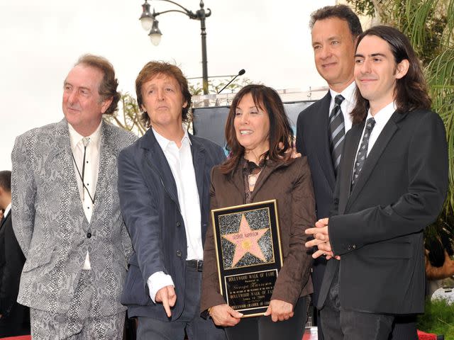 <p>Lester Cohen/WireImage</p> Eric Idol, Paul McCartney, Olivia Harrison, Tom Hanks and Dhani Harrison attend the ceremony honoring the late George Harrison with a star on The Hollywood Walk of Fame on April 14, 2009.