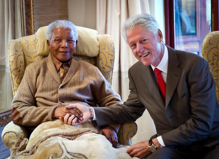 Bill Clinton (R) visiting Nelson Mandela on July 17, 2012 at his home in Qunu, Eastern Cape, on the eve of Mandela's 94th birthday