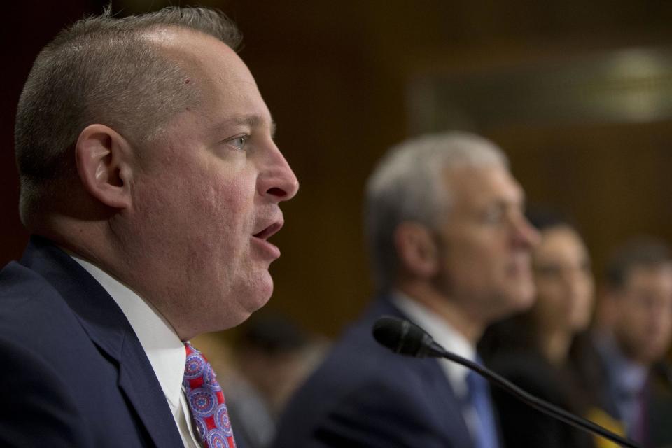 John J. Mulligan, executive Vice President and Chief Financial Officer of the Target Corporation, left, testifies on Capitol Hill in Washington, Tuesday, Feb. 4, 2014, before the Senate Judiciary Committee hearing on data breaches and combating cybercrime. From left are, Mulligan; Michael R. Kingston, senior Vice President and Chief Information Officer of the Neiman Marcus Group; Delara Derakhshani, Policy Counsel Consumer Union, and Fran Rosch, senior Vice President, Security Product and Services, Endpoint and Mobility, Symantec Corporation. (AP Photo/Pablo Martinez Monsivais)