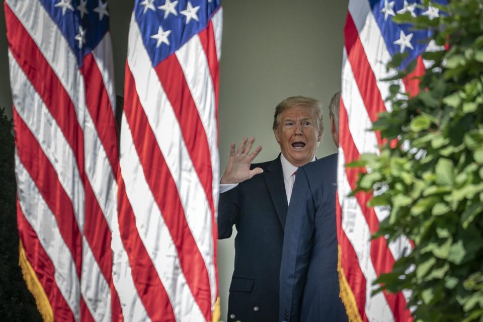 Donald Trump and American flags.