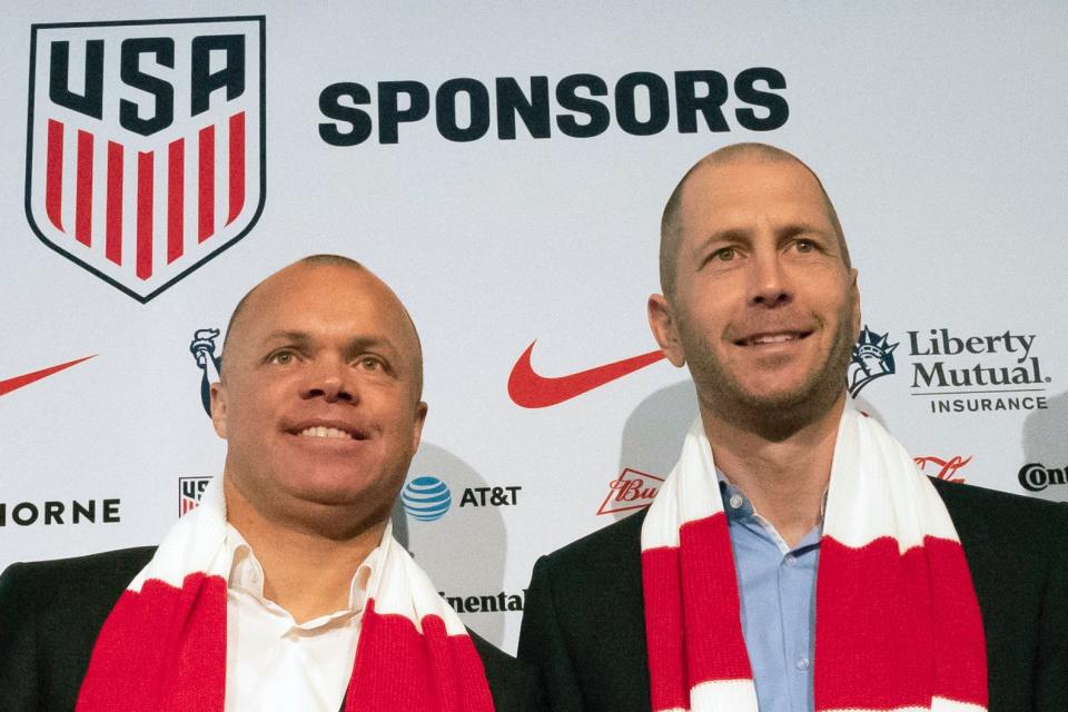 FILE - In this Dec. 4, 2018, file photo, Earnie Stewart, general manager of the U.S. men's national soccer team, and head coach Gregg Berhalter pose at a news conference in New York. The sporting director of the U.S. Soccer Federation says Gregg Berhalter's job is safe as men's national team coach despite some disappointing results. "When I evaluate Gregg and the coaching staff and what I've seen to date, I'm a pleased man, and an individual result is not going to change that. It's just not," sporting director Earnie Stewart said during a telephone conference call with reporters Tuesday, Nov. 12, 2019. (AP Photo/Mark Lennihan, File)