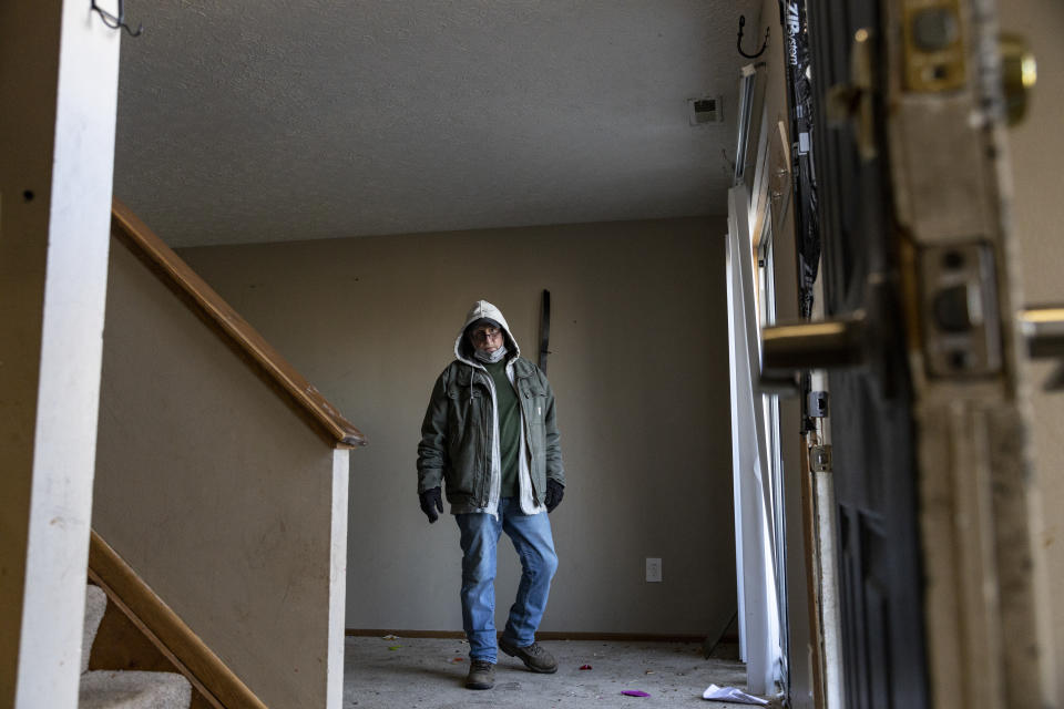 COLUMBUS, OH - MARCH 03: Worker Mark Smolinsky, 68, of Columbus, Ohio searches a home under eviction in the unincorporated community of Galloway on March 3, 2021 west of Columbus, Ohio. Property Management teams are given 1 1/2 hours to remove all items from the property under supervision of the service bailiff. (Photo by Stephen Zenner/Getty Images)