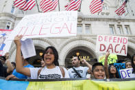 <p>Immigration rights demonstrators hold signs in front of the Trump International Hotel in Washington to oppose President Trump’s decision to end the DACA program for “dreamers” on Tuesday, Sept. 5, 2017. (Photo : Bill Clark/CQ Roll Call/Getty Imaages) </p>