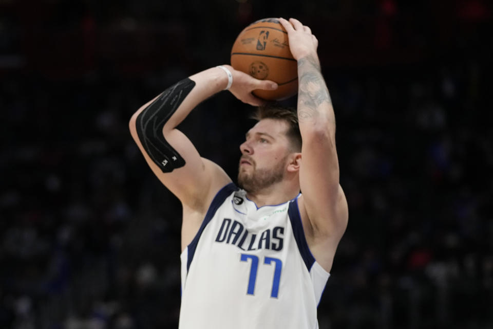 Dallas Mavericks guard Luka Doncic takes a shot during the second half of an NBA basketball game against the Detroit Pistons, Thursday, Dec. 1, 2022, in Detroit. (AP Photo/Carlos Osorio)