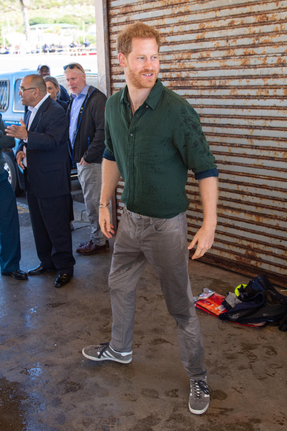 Our rugged Prince wore a forest green shirt with grey chinos and matching Adidas Gazelle trainers to visit Kalk Bay Harbour [Photo: Getty Images]