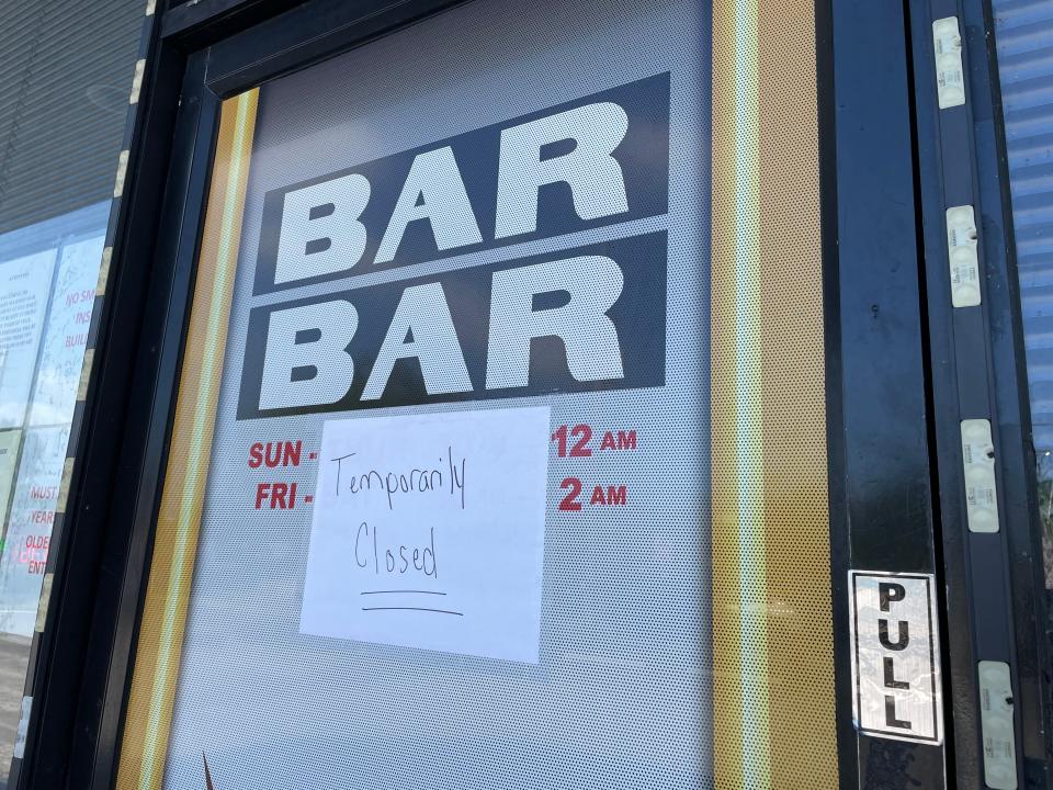 A "temporarily closed" sign was taped to the front door of the Triple Royal Arcade, 2061 S. U.S. 1, Fort Pierce on Thursday, May 11, 2023, amid a statewide crackdown on illegal slot machines.