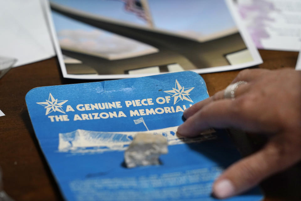 A piece of the USS Arizona Memorial, given to Teri Mann Whyatt as a child, is displayed at her home Wednesday, July 14, 2021, in Newcastle, Wash. Whyatt's uncle, William Edward Mann, died on the USS Arizona during the bombing of Pearl Harbor. In recent years, the U.S. military has taken advantage of advances in DNA technology to identify the remains of hundreds of sailors and Marines who died in the 1941 bombing of Pearl Harbor and has sent them home to their families across the country for burial. The remains of 85 unknowns from the USS Arizona, which lost more men during the attack than any other ship, haven't received this treatment, however. (AP Photo/Elaine Thompson)