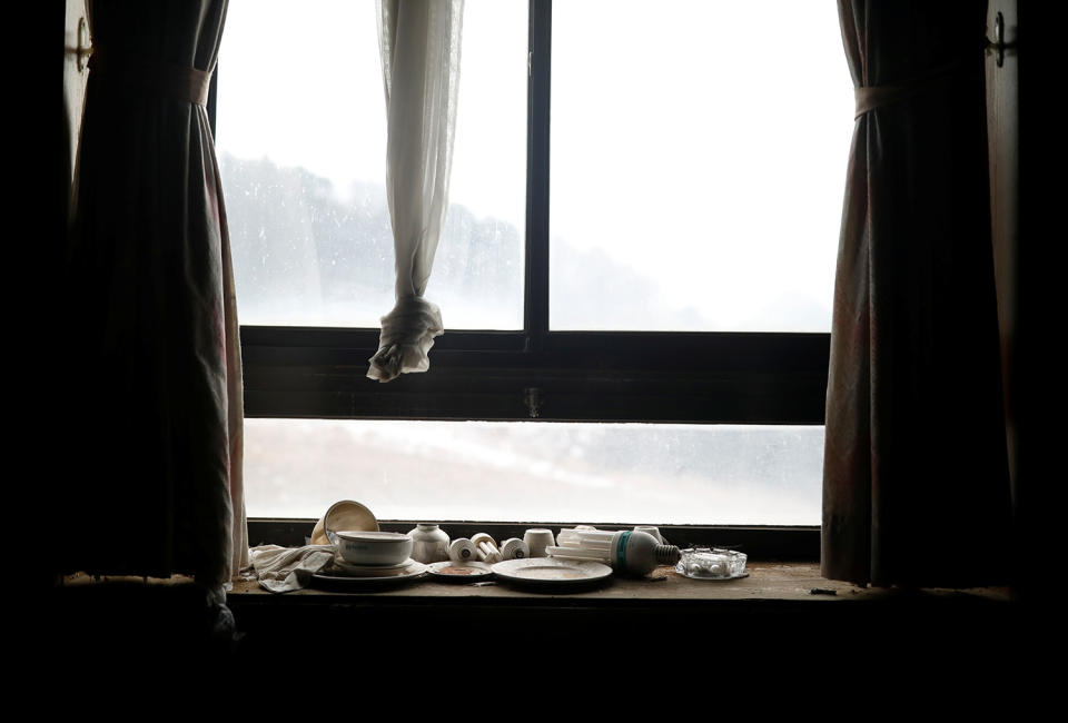 <p>Light bulbs, bowls and plates lie on a windowsill at the abandoned Alps Ski Resort located near the demilitarized zone separating the two Koreas in Goseong, South Korea, Jan. 17, 2018. (Photo: Kim Hong-Ji/Reuters) </p>