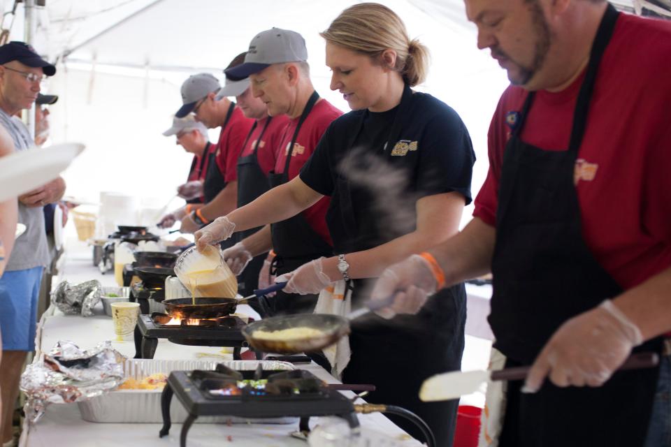 Volunteers help put on the Ostrich Egg Breakfast, an event put on by the Oklahoma Zoological Society for ticket holders to enjoy all-you-can-eat pancakes, sausage, bacon, scrambled eggs, and omelets cooked to order.