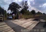 Shocking CCTV footage has been released which shows people risking their lives on level crossings - including a father and his young daughter posing for a photo shoot. The reckless father can be seen taking pictures of the little girl - who appears to be of primary school age - in different directions on the crossing. Their car can be seen in the background with its doors open as the youngster adopts various poses and occasionally looks behind her for approaching trains. Another shocking clip captured on CCTV shows a group of cyclists who dismount their bikes and line up for a group photo on the crossing.