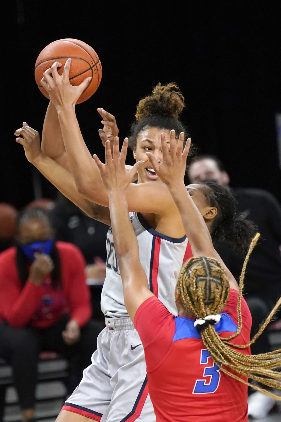 Connecticut's Olivia Nelson-Ododa is pressured by DePaul's Deja Church (3) and Darrione Rogers during the first half of an NCAA college basketball game Sunday, Jan. 31, 2021, in Chicago. (AP Photo/Charles Rex Arbogast)