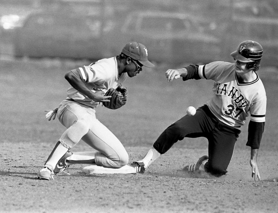 Tennessee State second baseman James Banks, left, is getting something off his chest, in this case the baseball, as Vanderbilt catcher Scotti Madison slides into second base. Vanderbilt erupted for 10 runs in the first inning for a 13-7 victory March 26, 1980, at McGugin Field, where TSU chose to play its home game with the Commodores.