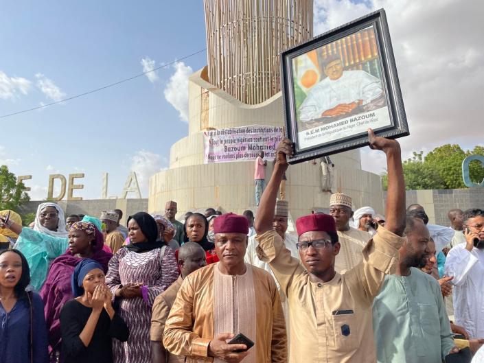 Supporters of Niger president Mohamed Bazoum gather to show their support for him in Niamey on 26 July 2023 (AFP via Getty Images)