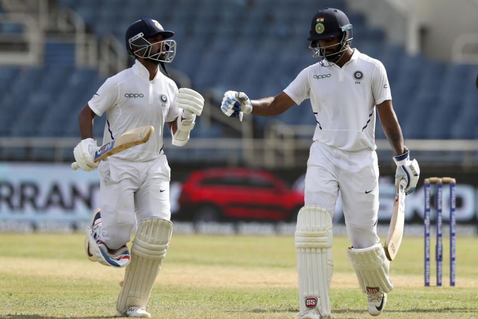 India's batsmen Ajinkya Rahane, left, and Hanuma Vihari leave the field after declaring their second innings against West Indies with a lead of 467 runs with 6 wickets remaining during day three of the second Test cricket match at Sabina Park cricket ground in Kingston, Jamaica Sunday, Sept. 1, 2019. (AP Photo/Ricardo Mazalan)