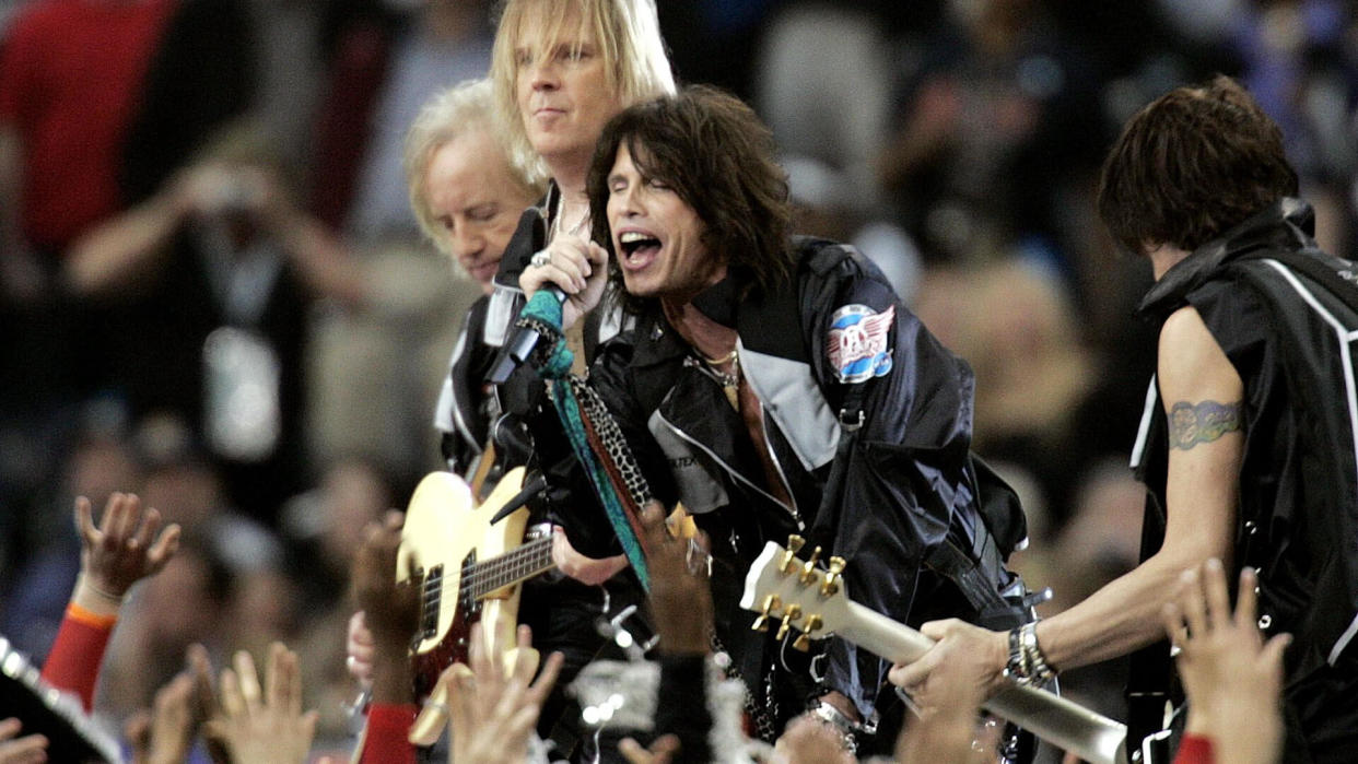 Mandatory Credit: Photo by MICHAEL CONROY/AP/REX/Shutterstock (6419138a)PERRY Aerosmith members (l-r) Brad Whitford, Tom Hamilton, Steven Tyler and Joe Perry rock during the opening show for Super Bowl XXXVIII, in HoustonSUPER BOWL, HOUSTON, USA.