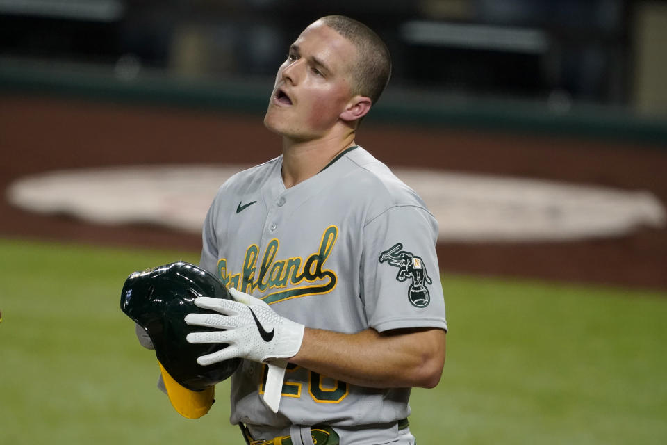 Oakland Athletics' Matt Chapman walks behind the plate after being hit in the head by a pitch from Texas Rangers' Kyle Gibson in the fourth inning of a baseball game in Arlington, Texas, Tuesday, Aug. 25, 2020. Chapman continued playing in the game. (AP Photo/Tony Gutierrez)