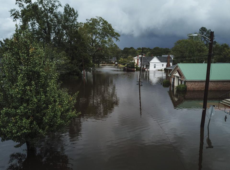 <p>Update: Hurricane Florence has made its way out of the Carolinas, but people are still recovering from the aftermath of the tropical storm. According to <em><a rel="nofollow noopener" href="https://www.nytimes.com/2018/09/17/us/hurricane-florence-live-updates.html" target="_blank" data-ylk="slk:The New York Times;elm:context_link;itc:0;sec:content-canvas" class="link ">The New York Times</a></em>, at least 17 deaths were blamed on Hurricane Florence and flash flood warnings were still in effect in parts of North and South Carolina as of Monday.<br></p><p>On Friday, <a rel="nofollow noopener" href="https://www.cnn.com/2018/09/14/us/hurricane-florence-south-east-coast-wxc/index.html" target="_blank" data-ylk="slk:CNN;elm:context_link;itc:0;sec:content-canvas" class="link ">CNN</a> reported that Hurricane Florence diminished from a Category 4 storm to a Category 1 tropical storm. However, the hurricane brought up to 40 inches of heavy rainfall in affected areas, which include the Carolinas, Georgia, and Virginia, according to forecasters. <em><a rel="nofollow noopener" href="https://www.independent.co.uk/news/world/americas/hurricane-florence-nc-residents-evacuation-god-north-carolina-evacuate-storm-a8536611.html" target="_blank" data-ylk="slk:The Independent;elm:context_link;itc:0;sec:content-canvas" class="link ">The Independent</a> </em>reported that at least 1.7 million people were forced to evacuate. </p><p>Here are some of the most dramatic photos that show the full impact of the storm.</p>