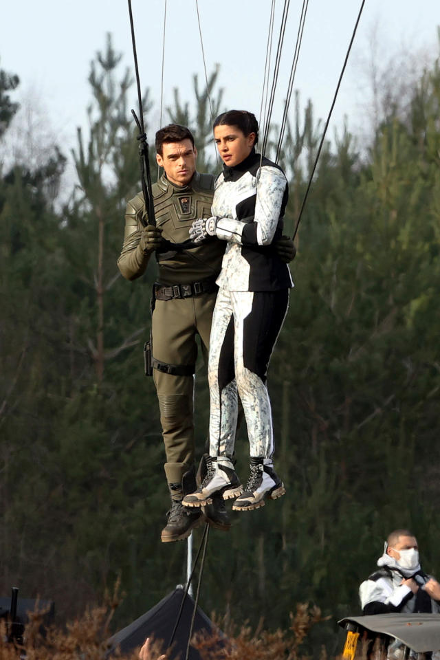 Adam Driver double-masks while rehearsing on a motorcycle on the set of  Gucci