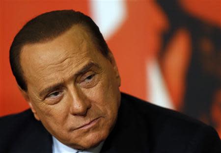 Italy's former prime minister Silvio Berlusconi attends a news conference in Rome in this November 25, 2013 file photo. REUTERS/Alessandro Bianchi/Files