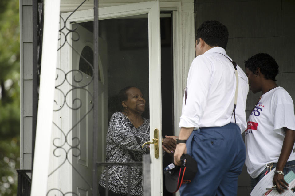 Ben Jealous chats with a voter while canvassing in Baltimore. (Photo: The Washington Post via Getty Images)