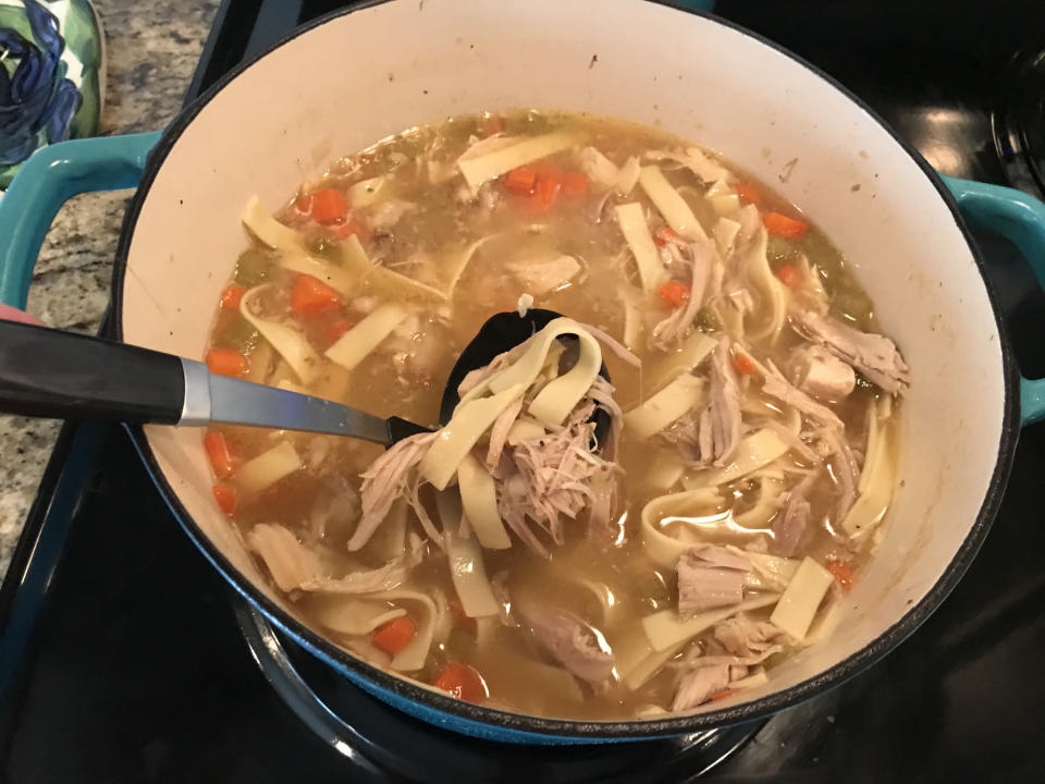 A big pot of chicken noodle soup