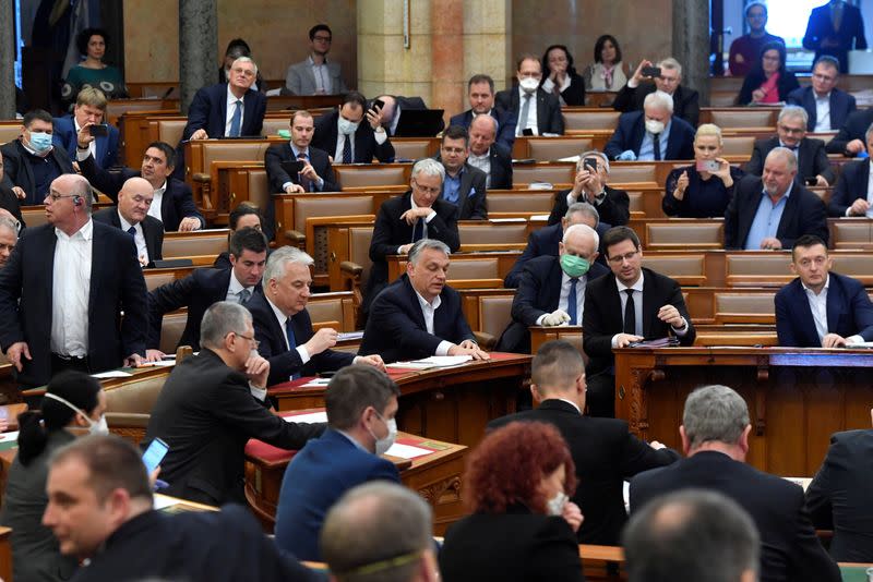 Hungarian Prime Minister Viktor Orban votes the law granting the government special powers to combat the coronavirus disease (COVID-19) crisis at the Hungarian parliament in Budapest