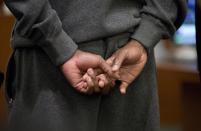 Floyd Mayweather Jr., left, appears before Clark County Court justice of the peace Melissa Saragosa to turn himself in to begin a 90-day jail term, Friday, June 1, 2012, in Las Vegas. The undefeated five-division champion surrendered Friday before the judge who sentenced him in December for attacking his ex-girlfriend in September 2010 and then allowed him to remain free long enough to headline a May 5 fight. (AP Photo/Julie Jacobson)