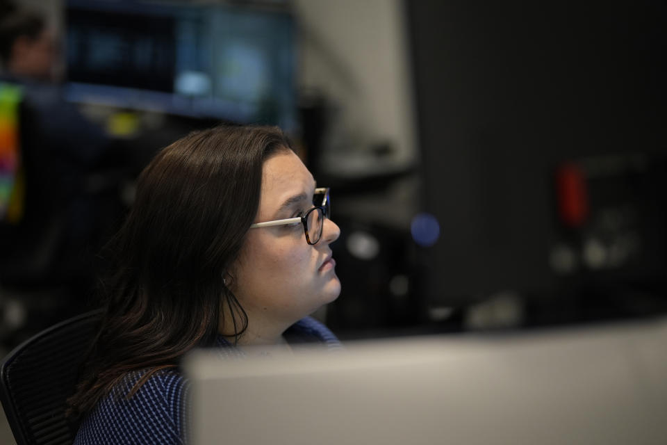 ZeroEyes analyst Brooke McKernan monitors alerts at the company's operations center, Friday, May 10, 2024, in Conshohocken, Pa. (AP Photo/Matt Slocum)