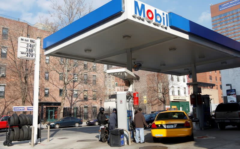 FILE PHOTO: A taxi is refuelled at a gas station on Manhattan's West Side in New York