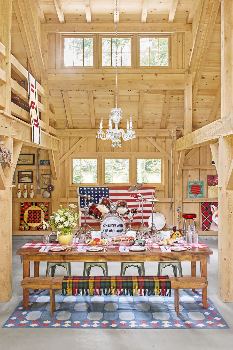 barn interior with americana accents and a dining table set up for dinner