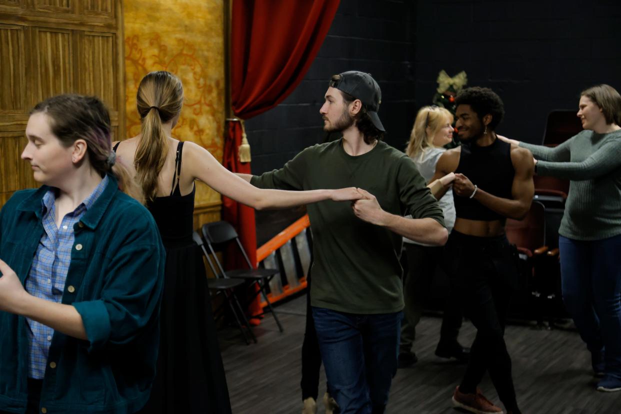 Justin Marlow, center, and Olivia Akers rehearse a Regency Era dance on Nov. 28 for Oklahoma Shakespeare in the Park's production of "Jane Austen's Christmas Cracker" in Oklahoma City.