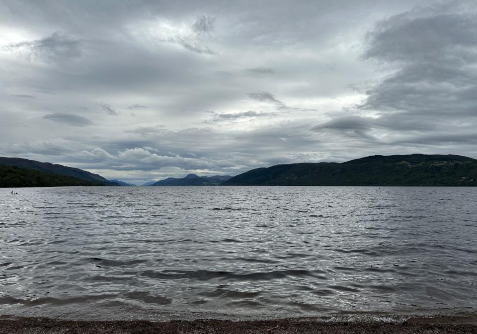 Dores, UK. 27th Aug, 2023. View of the Loch Ness lake. In Scotland on Saturday began what is believed to be the largest search for the Loch Ness monster, called Nessie, in decades. Credit: Benedikt von Imhoff/dpa/Alamy Live News