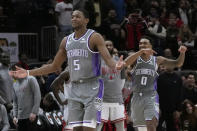 Sacramento Kings' De'Aaron Fox celebrates his go-ahead 3-pointer against the Chicago Bulls in the final second of an NBA basketball game Wednesday, March 15, 2023, in Chicago. The Kings won 117-114. (AP Photo/Charles Rex Arbogast)