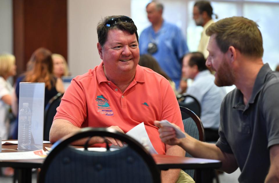 John Horne, left, owns the Anna Maria Oyster Bar chain of restaurants.