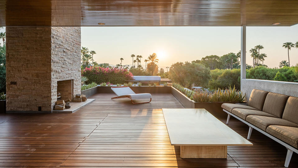 The elevated deck features a wood-burning fireplace. - Credit: Photo: Daniel Solomon/Vista Sotheby's International Realty