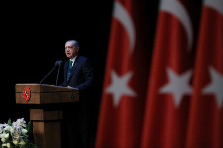 FILE PHOTO: Turkish President Tayyip Erdogan makes a speech during a meeting in Ankara, Turkey April 9, 2018. Murat Cetinmuhurdar/Presidential Palace/Handout via REUTERS