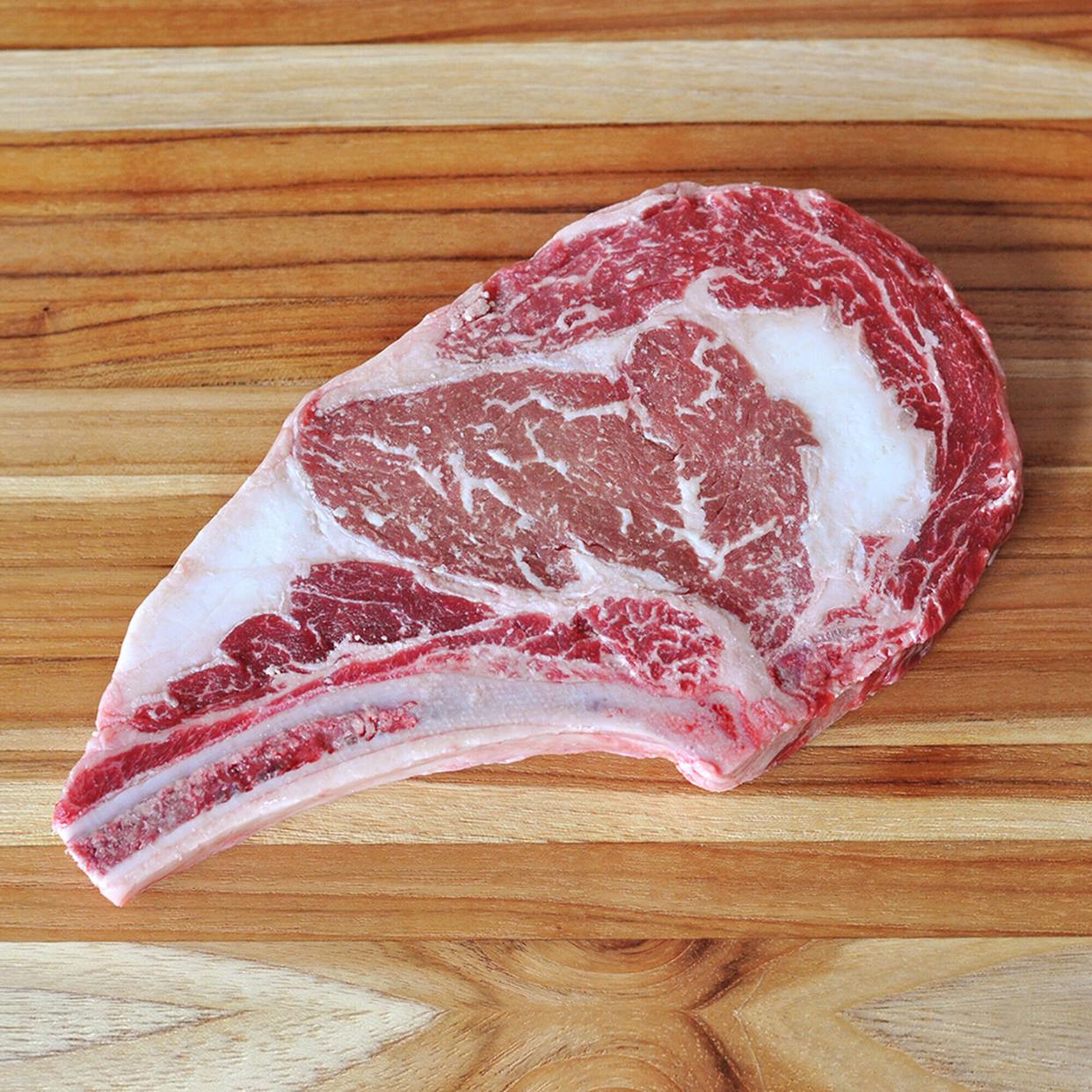 raw waygu steak on wooden surface