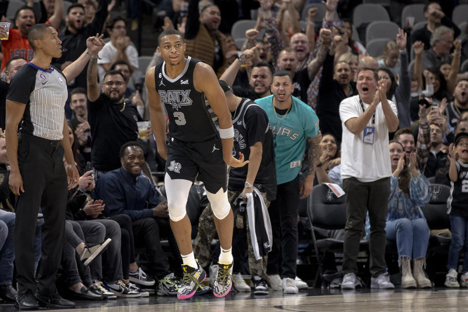 San Antonio Spurs forward Keldon Johnson (3) celebrates a three pointer during the second half of an NBA basketball game against the Chicago Bulls, Friday, Oct. 28, 2022, in San Antonio. (AP Photo/Nick Wagner)