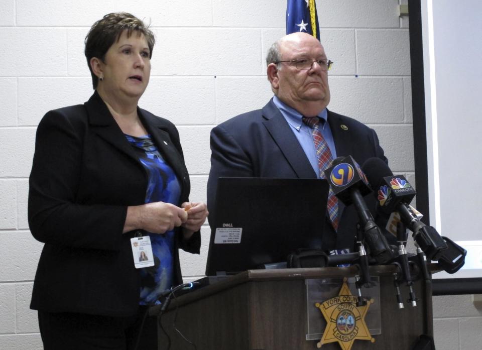 York County Sheriff's Office attorney Krisite Jordan, left, speaks as York County Sheriff Bruce Bryant, right, listens during a news conference on Wednesday, March 12, 2014, in York, S.C., about a shooting of a 70-year-old man by one of his deputies. Bryant said he thinks his officer did the right thing because the man's cane could have been mistaken for a gun. (AP Photo/Jeffrey Collins)