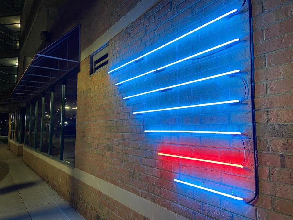 Troy Ramos' neon light work "Always on my Mind" is shown. The piece is one of two outdoor public art installations at 80 W. Michigan Ave.