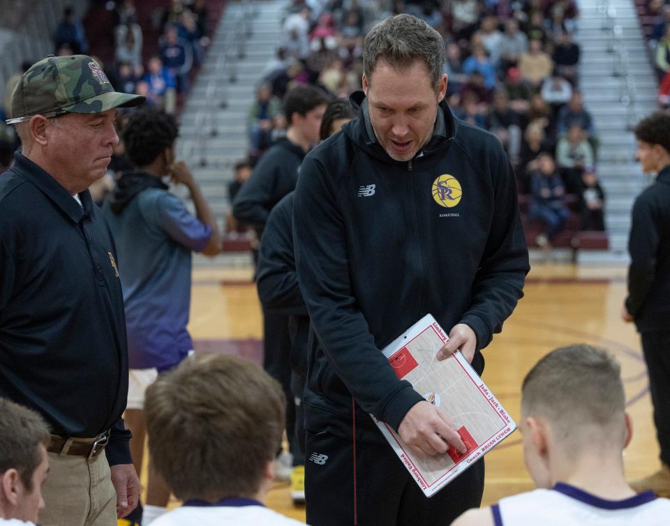 St. Rose coach Brian Lynch goes over game plan before introductions.  St Rose Boys Basketball vs Red Bank Regional in BUC Basketball Classic in Red Bank NJ on December 30, 2022. 